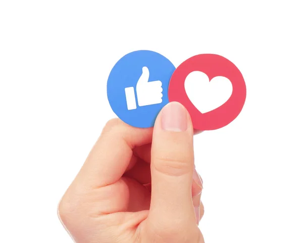 Hand holds Facebook Like and Love Empathetic Emoji Reactions — Stock Photo, Image