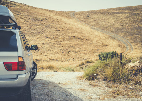 Tourist car and dirt road