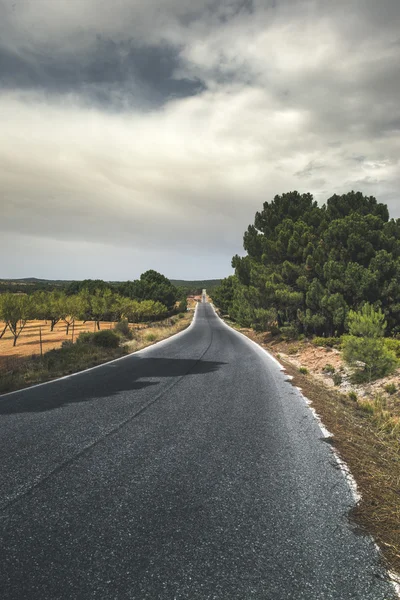 Road in the mountain. Dramatic scene — Stock Photo, Image