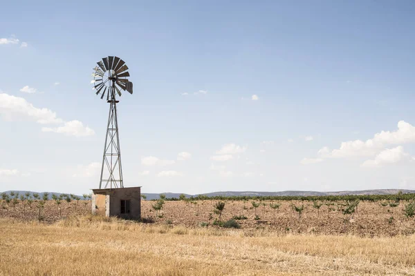 Old windmill at blue cloudy sky — Stock Photo, Image