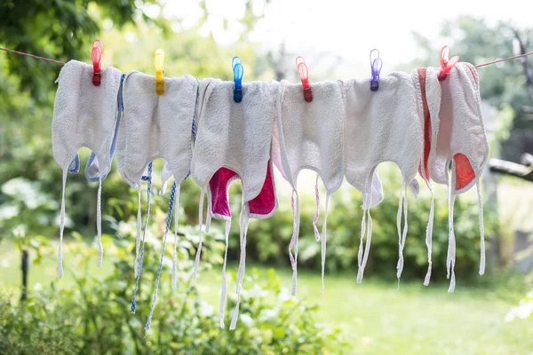 Baby bibs on laundry — Stock Photo, Image