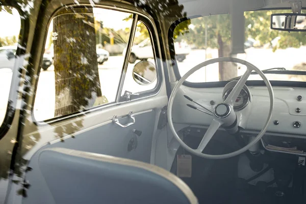 Interior of small white vintage car on the street. No people. Wh — Stock Photo, Image