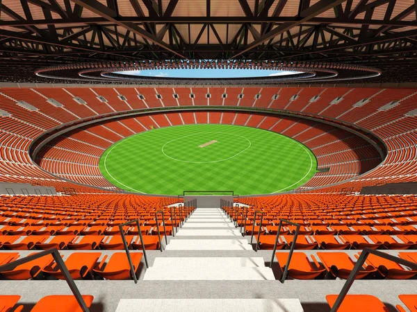 Красивий сучасний круглий крикетний стадіон з помаранчевими сидіннями та VIP-коробками для п'ятдесяти тисяч фанатів — стокове фото