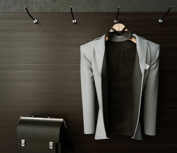 Business jacket on textured wall with briefcase concept photo background — Stock Photo, Image