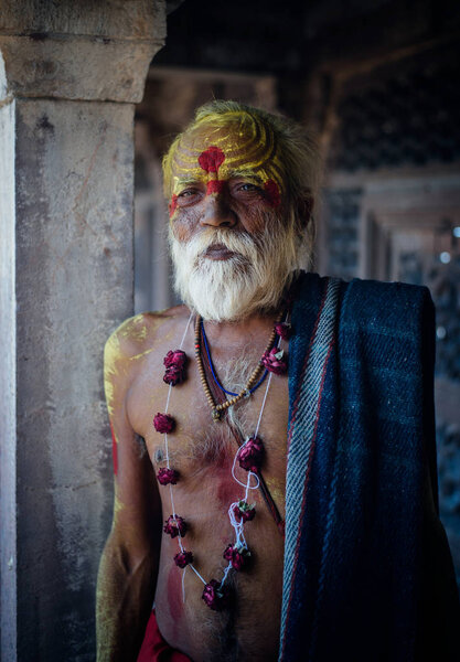 Hindu monk standing and looking at camera