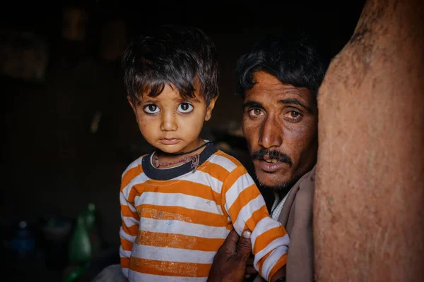 Man and boy looking at camera — Stock Photo, Image