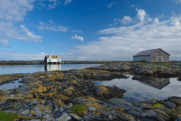 Old buildings on rocky shore — Stock Photo, Image