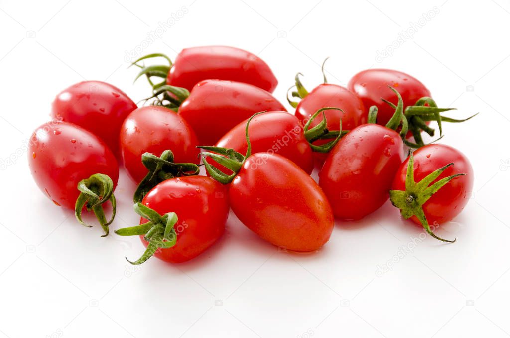 Fresh cherry tomatoes on white background