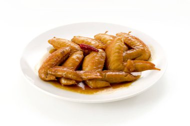 Tatlı ve baharatlı teriyaki tavuk kanadı. Kızartma ve teriyaki sosunda kaynatma.