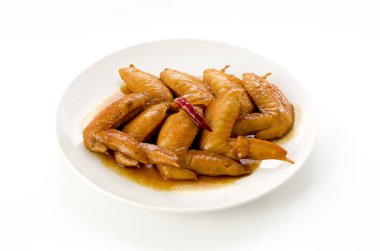 Tatlı ve baharatlı teriyaki tavuk kanadı. Kızartma ve teriyaki sosunda kaynatma.
