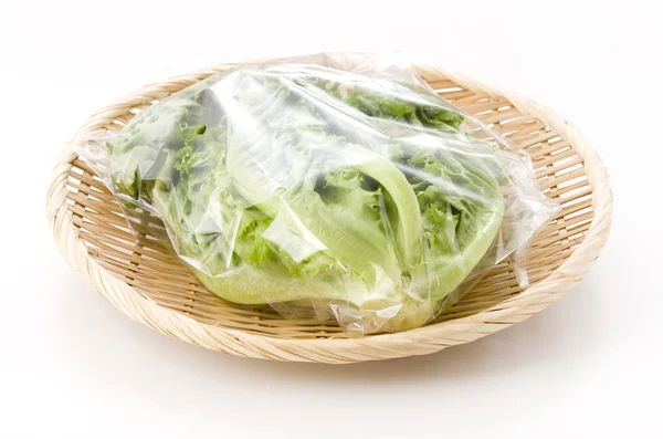 Fresh Green Leaves Lettuce Plastic Bag Bamboo Colander White Background — Stock Photo, Image