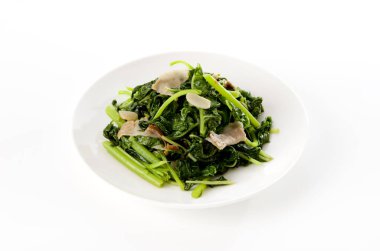 Kızartma Amaranth ve beyaz tabakta domuz eti