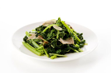 Kızartma Amaranth ve beyaz tabakta domuz eti