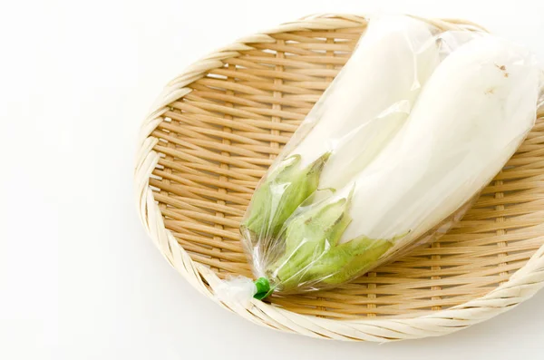 White Eggplant Plastic Bag Bamboo Colander White Background — Stock Photo, Image