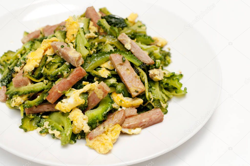 Goya Chanpuru is bitter melon stir-fried with pork and egg.Goya chanpuru is famously known as the local food of Okinawa, and is now eaten by people all over Japan