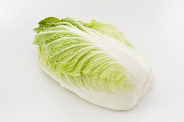 Napa cabbage or Chinese cabbage half, isolated white background clipart