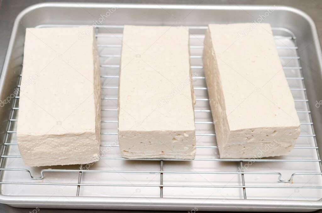 firm tofu on cooking aluminum tray  