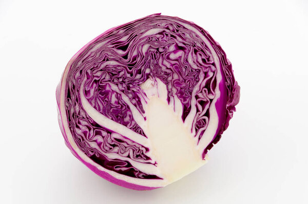 Sliced purple cabbage isolated on white background. 