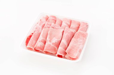 Thin sliced pork boston butt in plastic tray on white background 