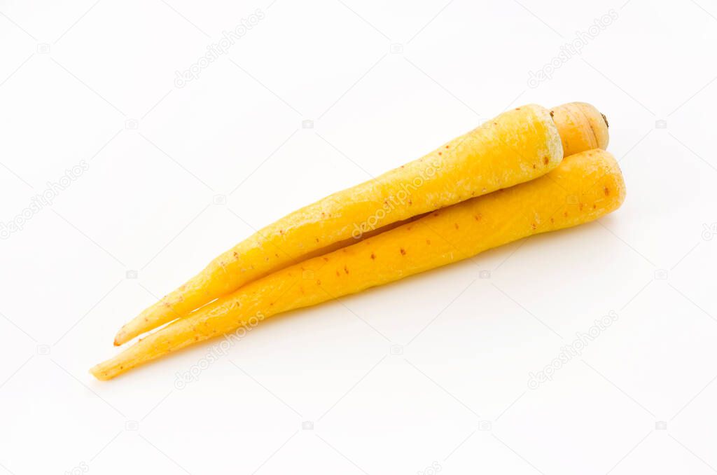 Shimaninjin, type of yellow carrot grown in Okinawa, yellow carrot on white background