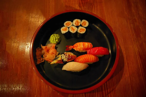 Asian fast food style, set of different sushi in a wooden big tr — Stock Photo, Image