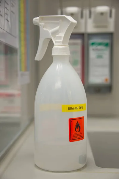 Lab spray bottle with ethanol labeled for disinfection from viru