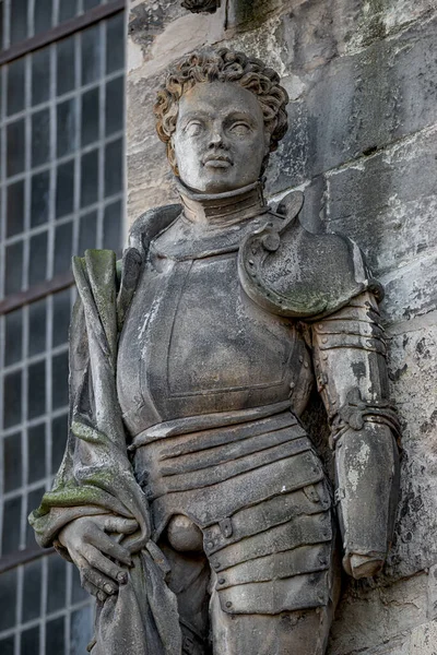 Ancient statue portrait of Saint Maurice (black Knight) as gatekeeper in Magdeburg Cathedral as Roman soldier from Thebes of 13 century, Magdeburg, Germany