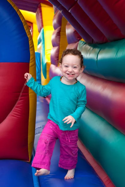 Happy toddler bounce in trampoline — Stock Photo, Image