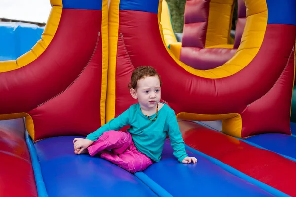 Toddler kid stopped in the game of bounce — Stock Photo, Image