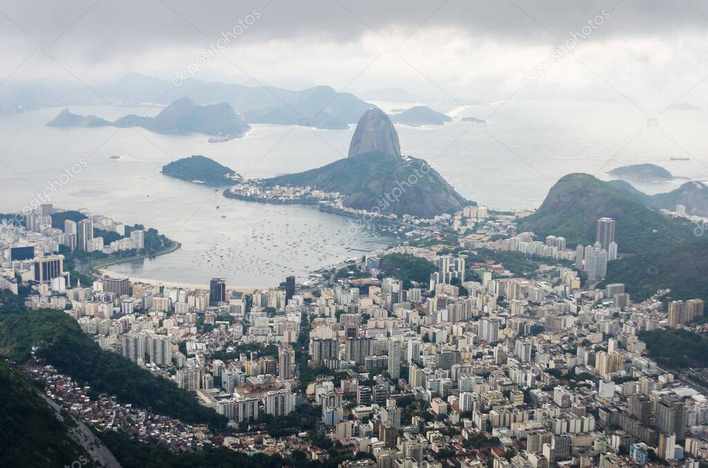 View of Rio de Janeiro from the Christ The Redeemer statue, with the Sugarloaf Mountain at the end of Botafogo Bay