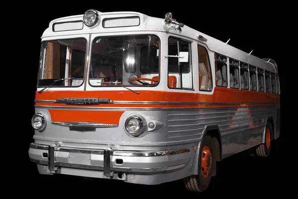 Gamla retro orange buss. Isolerad på svart bakgrund. — Stockfoto