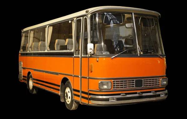 Oude retro oranje bus. Geïsoleerd op zwarte achtergrond. — Stockfoto