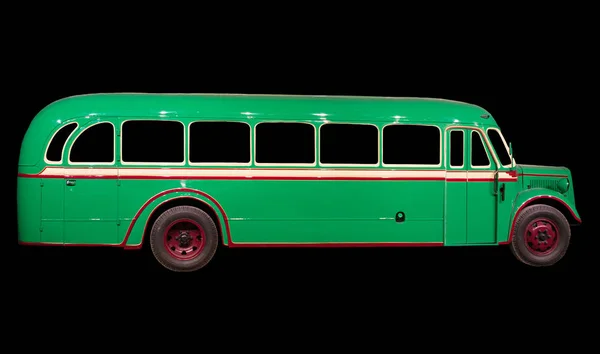 Oude retro groene bus. Geïsoleerd op zwarte achtergrond. — Stockfoto