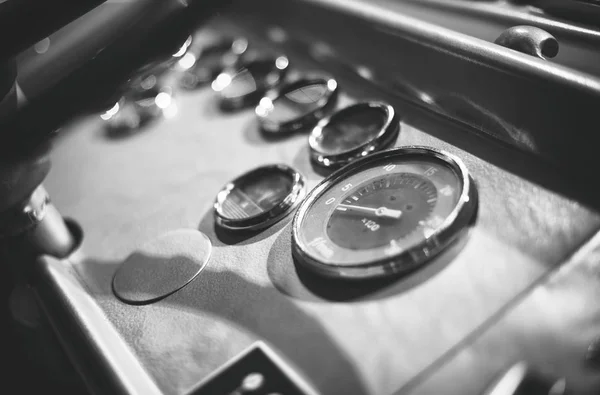 Dashboard inside of old bus cabin. Black and white. — Stock Photo, Image