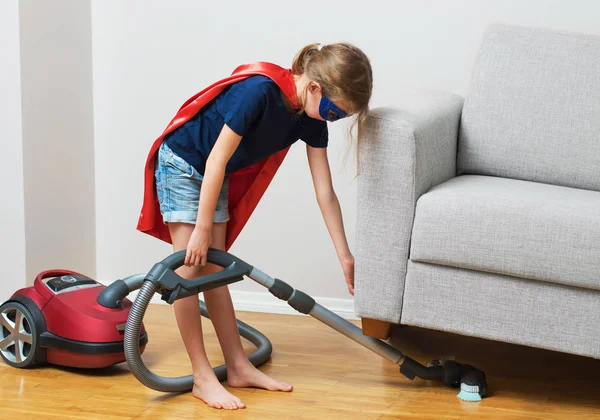 Super hero kid with vacuum cleaner. — Stock Photo, Image