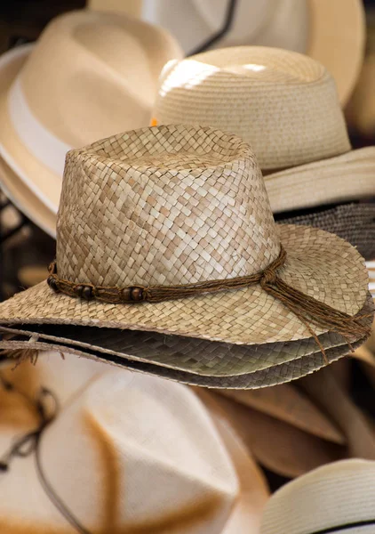 Straw hats for sale in the market.