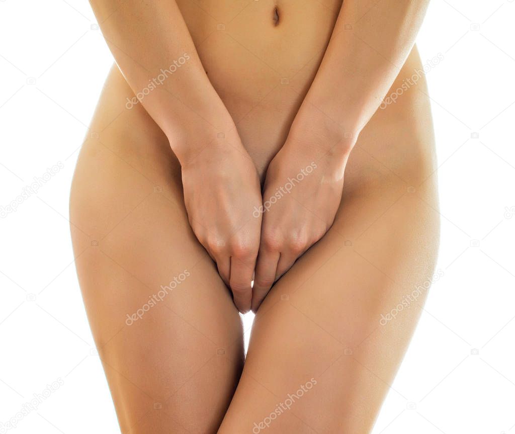 Shy naked woman posing. Isolated on white.