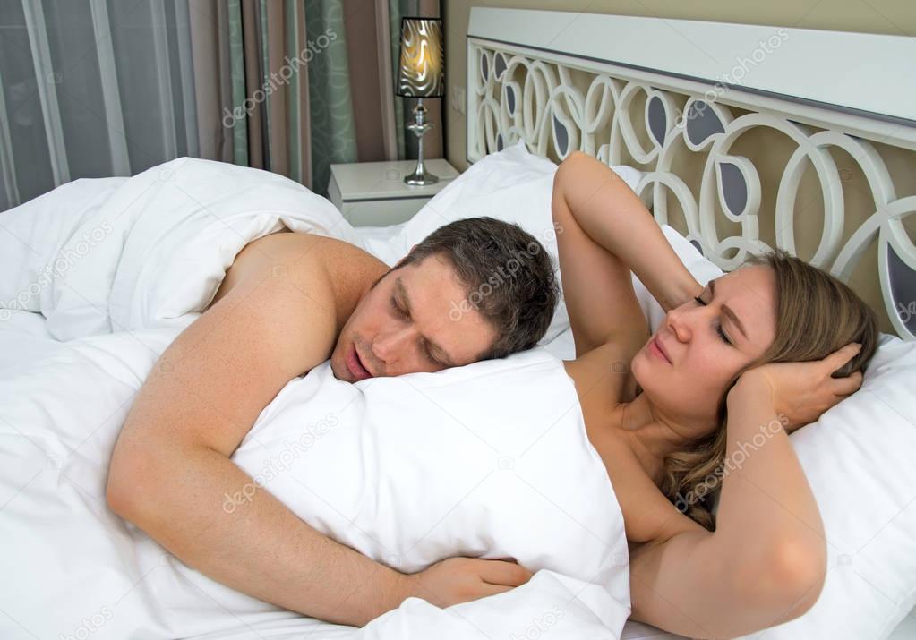 Woman can not sleep cause of man snoring.