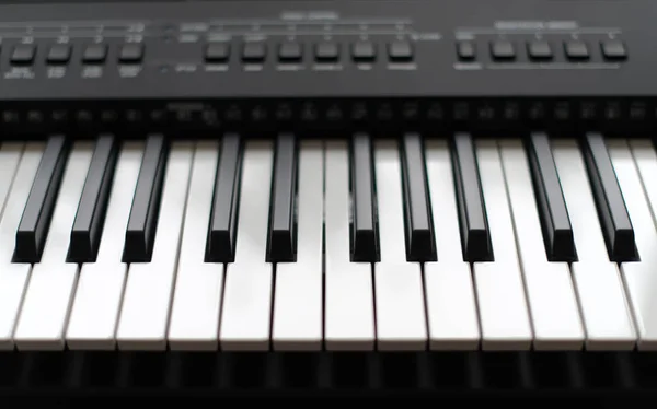 Professional midi keyboard synthesizer with knobs and controllers. — Stock Photo, Image