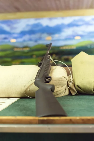 Rifle in shooting range in amusement park.