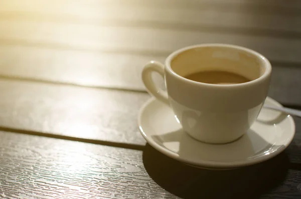 Cup of coffee on wooden table. — Stock Photo, Image