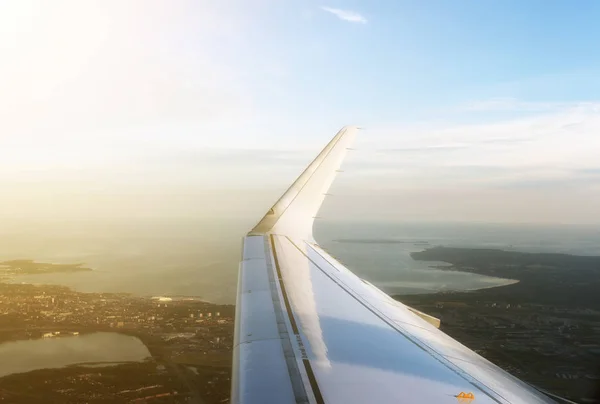 Aerial view of the plane wing over Tallinn city. — Stock Photo, Image