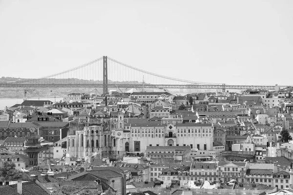 Alfama downtown and the 25 April Bridge in Lisbon, Portugal. — Stock Photo, Image