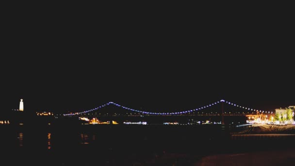 Bridge of 25th april in Lisbon at night. — Stock Video