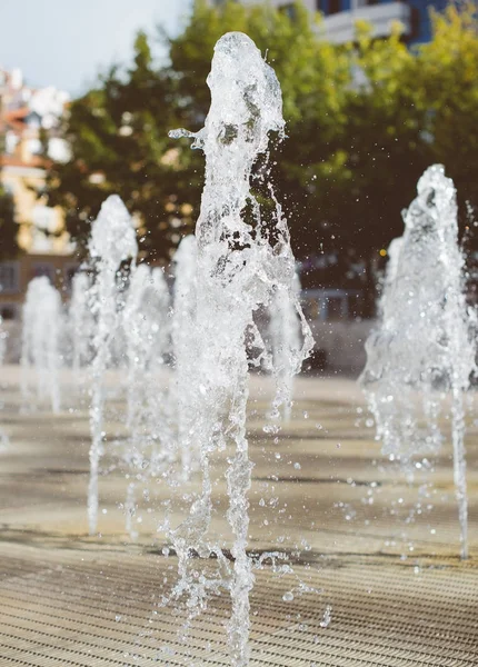 Small fountains in order to refresh themselves in the summer. — Stock Photo, Image
