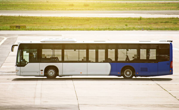 Airport shuttle bus standing on the airfield.