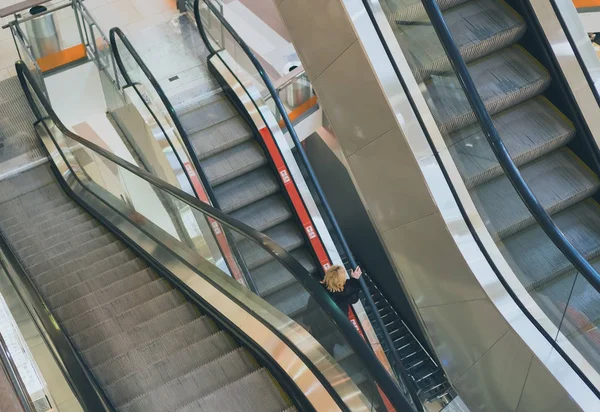 Escalator in the shopping mall interior.