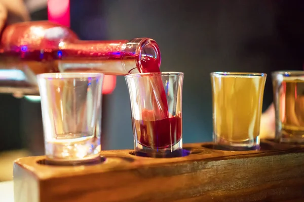 Shot glasses with liquor in the bar. — Stock Photo, Image