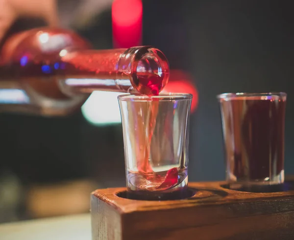 Shot glasses with liquor in the bar. — Stock Photo, Image