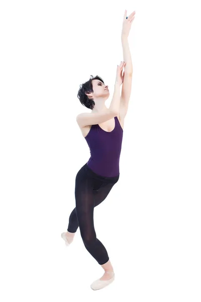 Ballerina sta ballando in studio su uno sfondo bianco isolato — Foto Stock